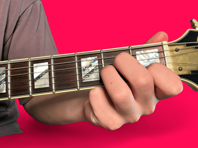 A minor over E guitar chord with finger positions